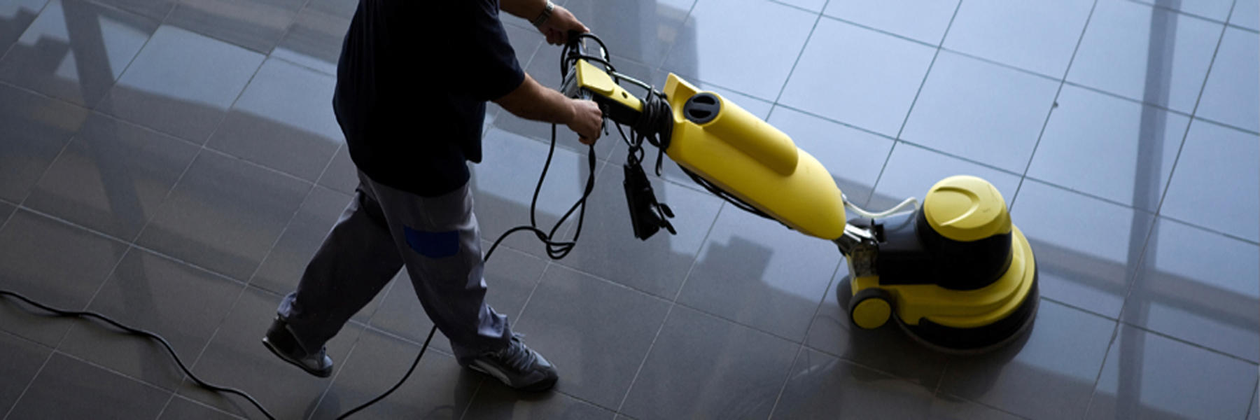 Restoration technician drying a water-damaged floor